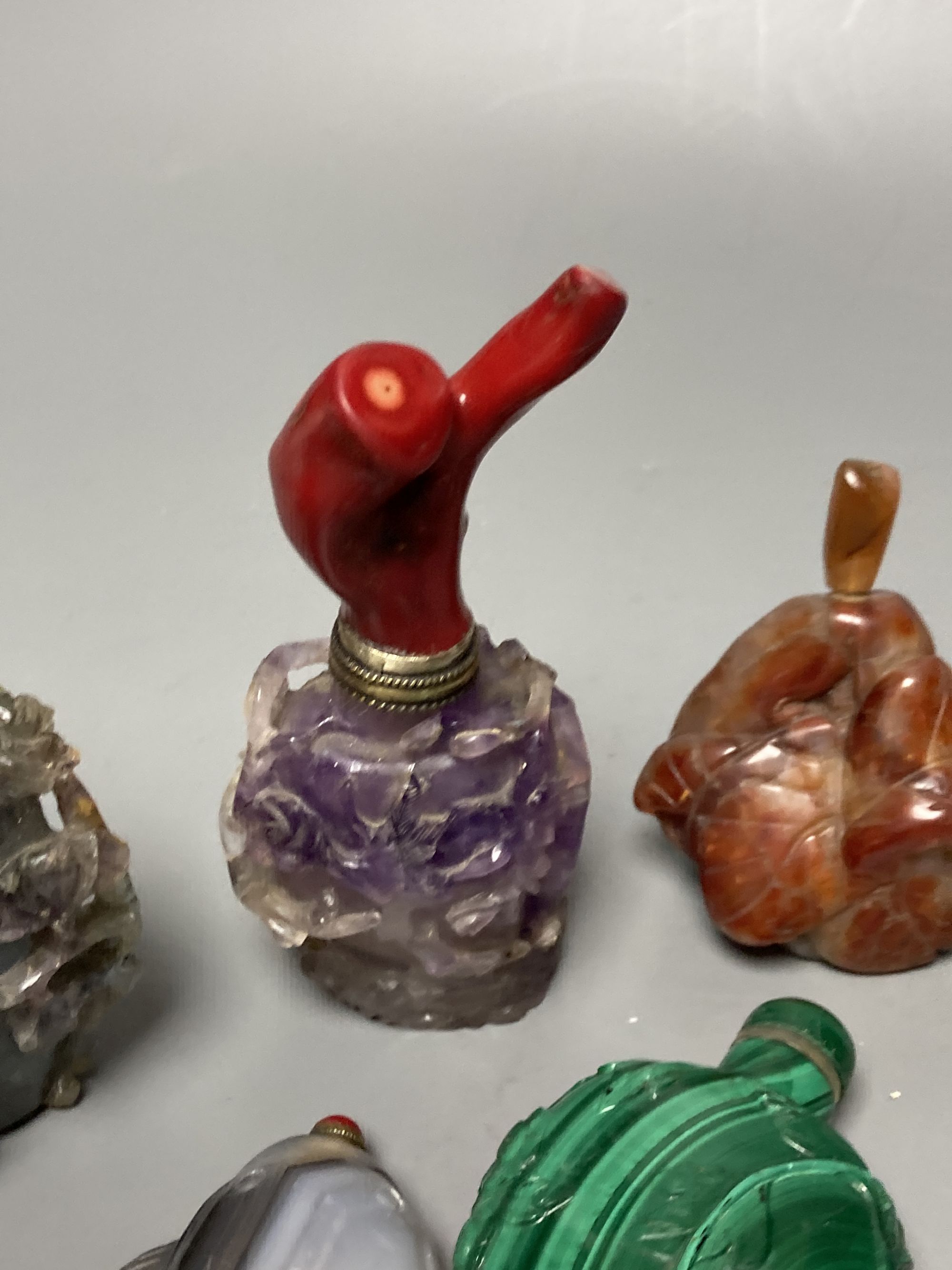 Five Chinese carved hardstone snuff bottles